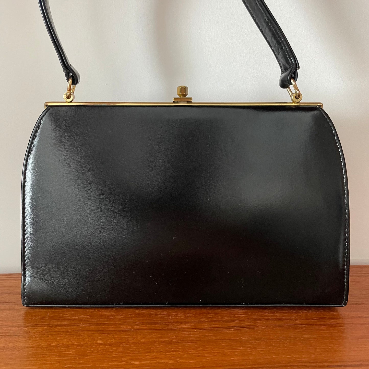 A Peter Lord Black Leather Kelly Handbag With Vintage Tapestry Detail