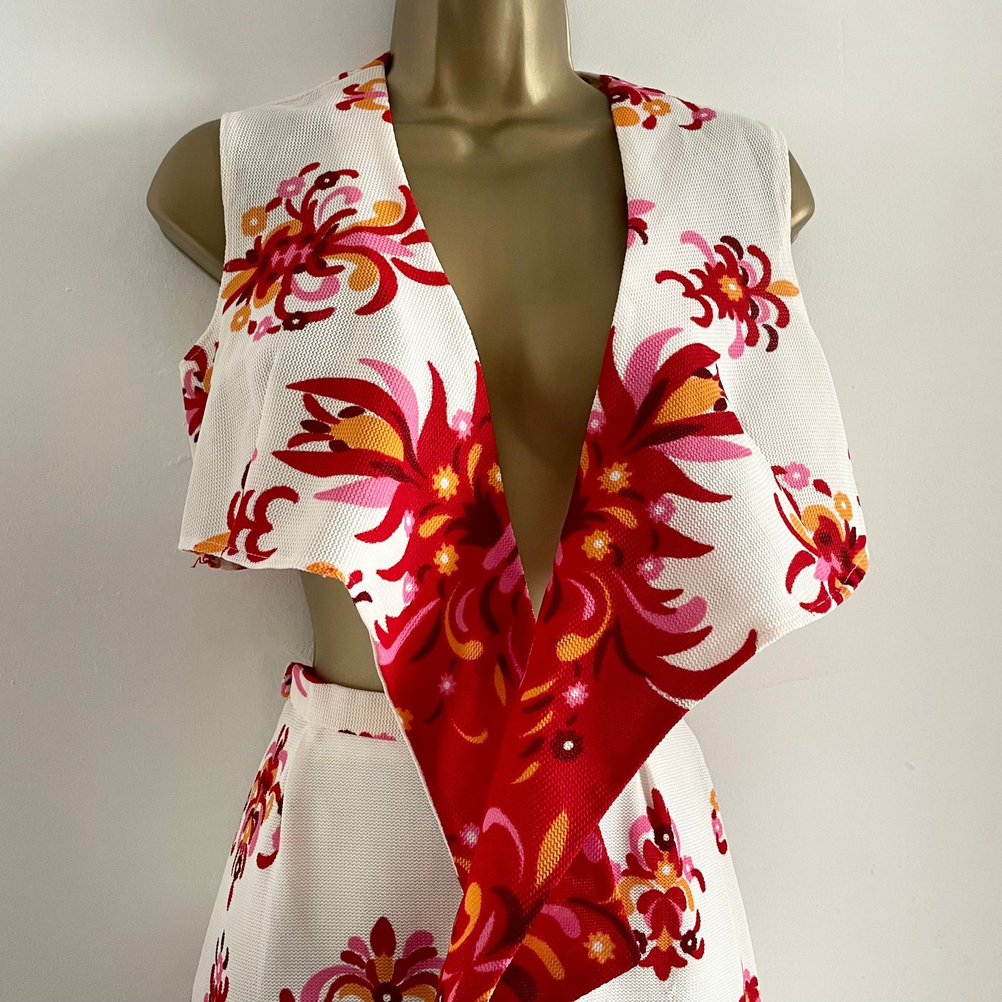 Vintage Prima Qualitat Set. White with red, pink & orange floral pattern. Tie top and Maxi skirt with slit. Polyester. Little mark to front of top