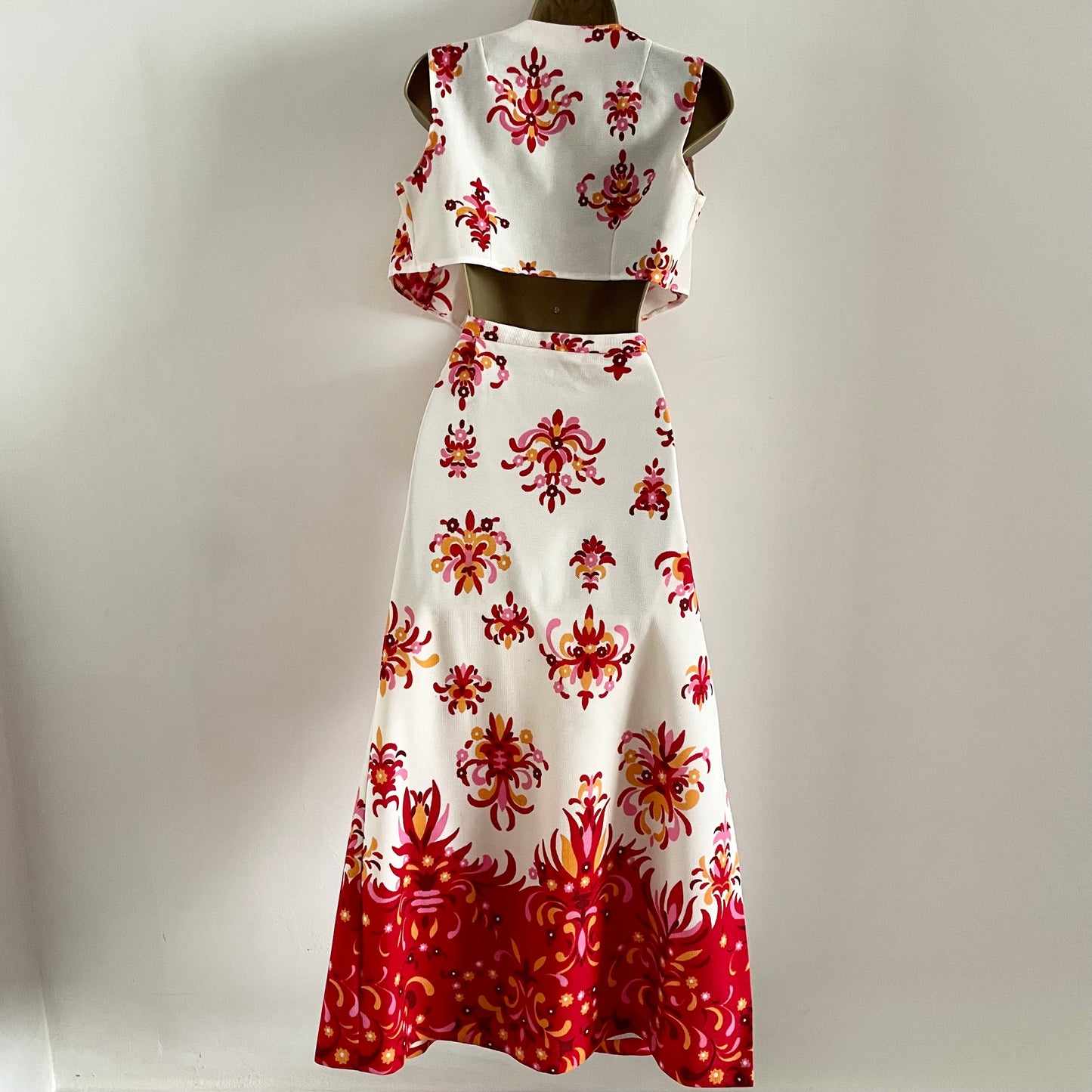 Vintage Prima Qualitat Set. White with red, pink & orange floral pattern. Tie top and Maxi skirt with slit. Polyester. Little mark to front of top