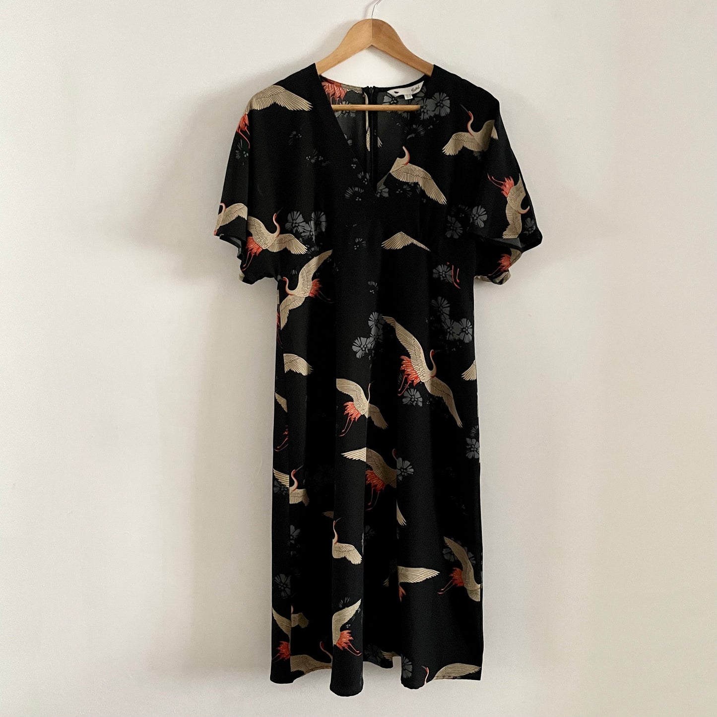 Preloved Black patterned Yumi Stork  dress. Batwing sleeves. Midi