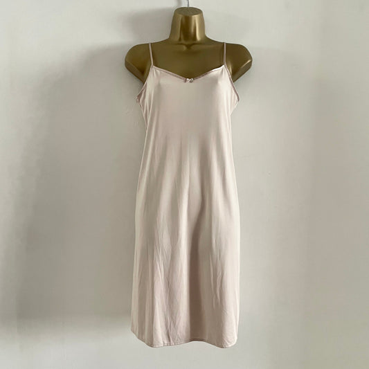 Vintage Nude slip dress with adjustable straps. Bow Detail