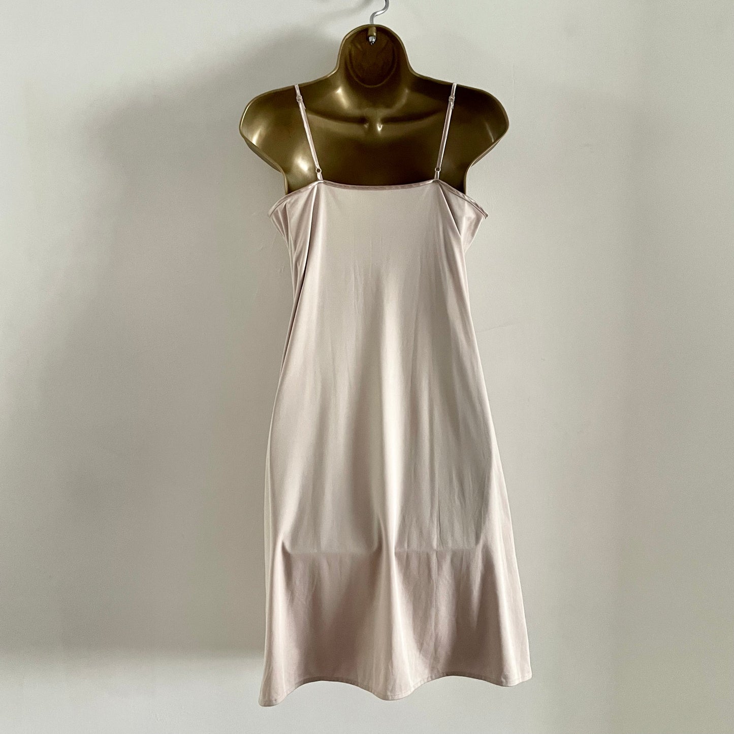 Vintage Nude slip dress with adjustable straps. Bow Detail