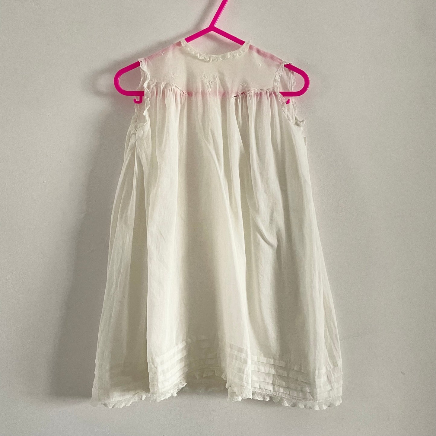 White embroidered baby dress sleeveless bottom fastening