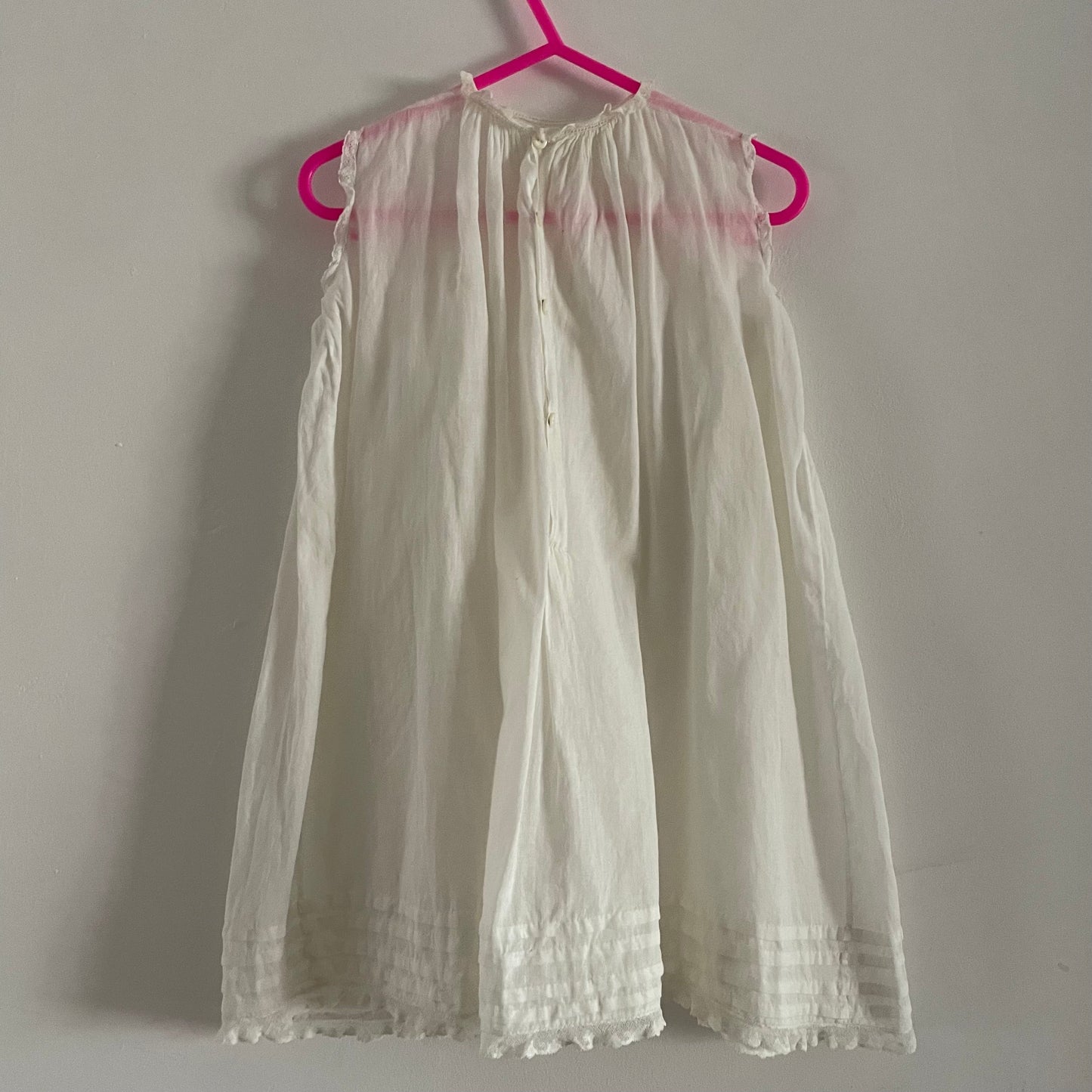 White embroidered baby dress sleeveless bottom fastening