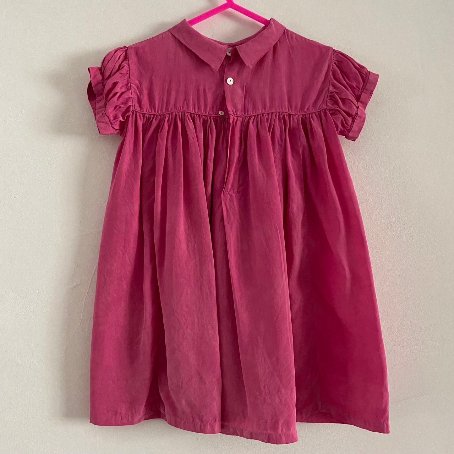 Hand dyed pink baby vintage children’s smock dress with collar and floral embroidery