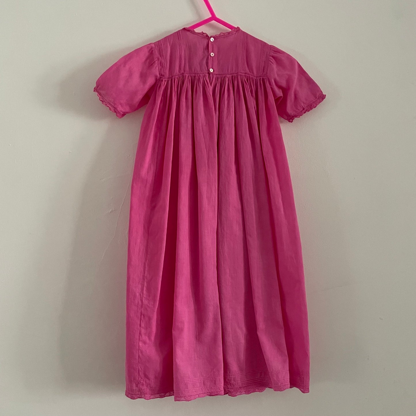 Hand dyed pink baby vintage children’s smock dress with lace detail