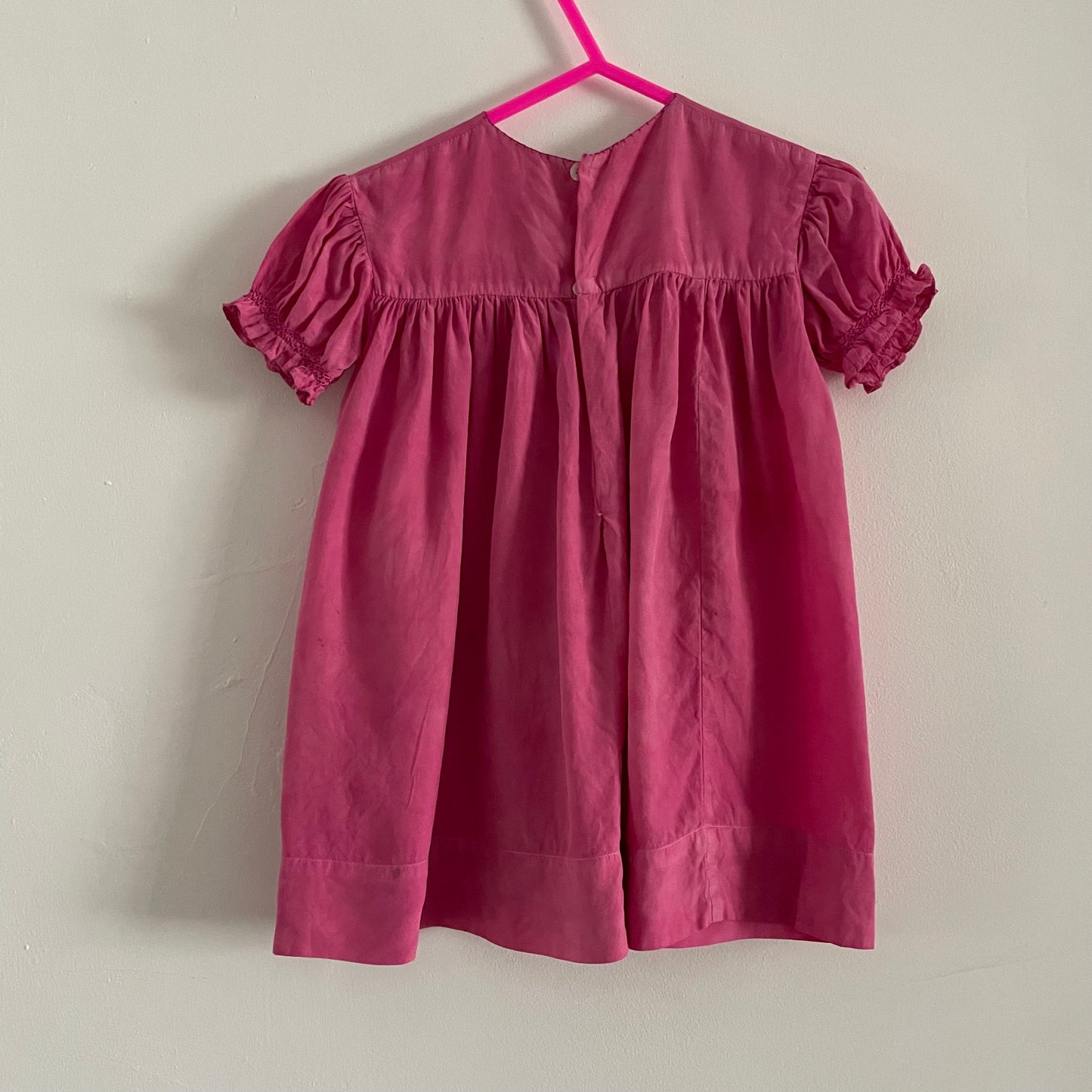 Hand dyed pink baby vintage children’s smock dress with stitched detail