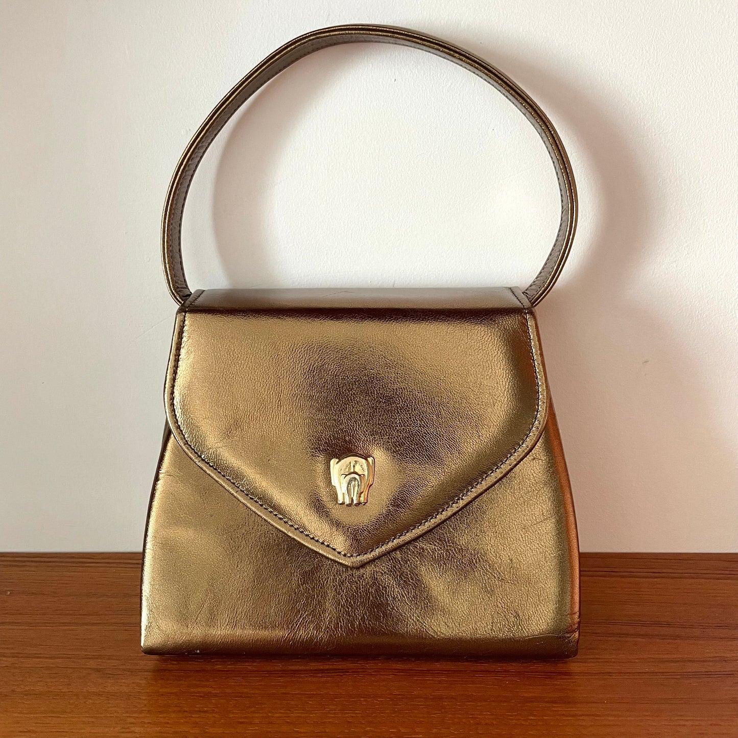 Vintage Gold Top Handle Handbag with Elephant Hardware and Detachable Shoulder Strap