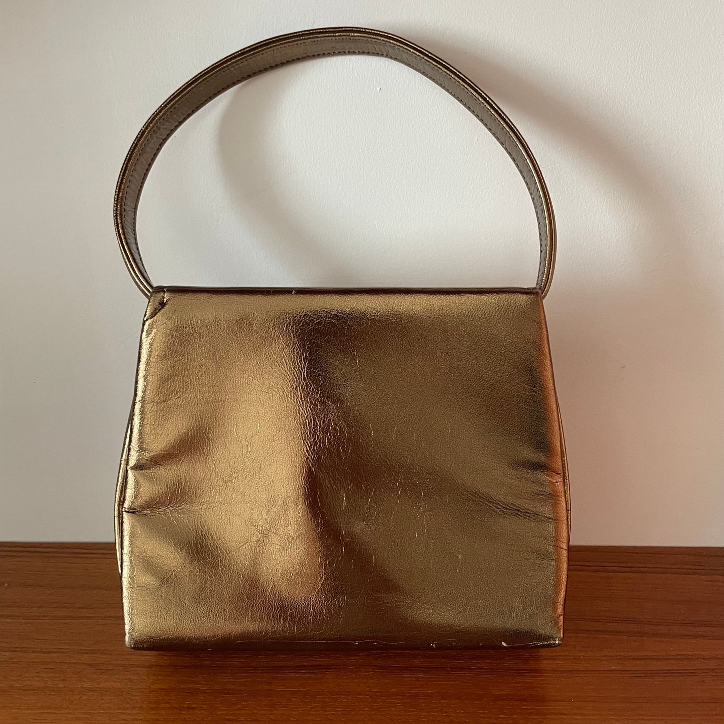 Vintage Gold Top Handle Handbag with Elephant Hardware and Detachable Shoulder Strap