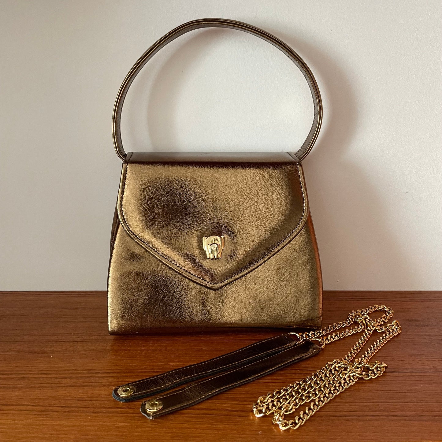 Vintage Gold Top Handle Handbag with Elephant Hardware and Detachable Shoulder Strap